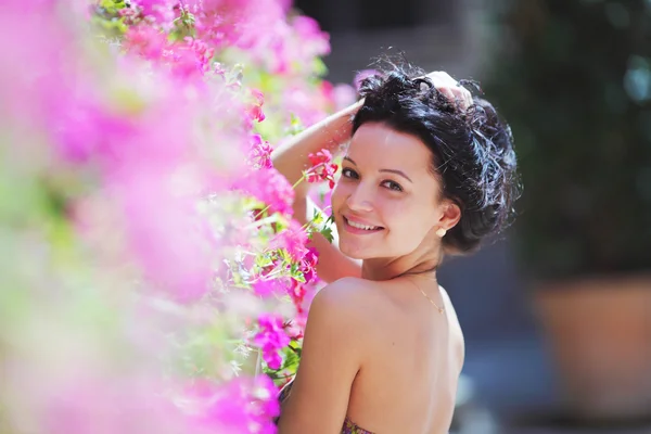 Woman in flowers — Stock Photo, Image
