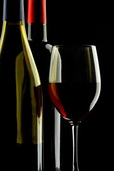 Rött vin glas silhuett svart bakgrund — Stockfoto