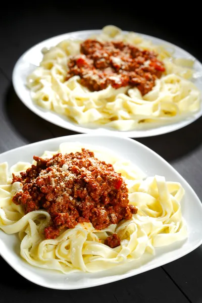 Spaghetti bolognese with parmesan cheese — Stock Photo, Image