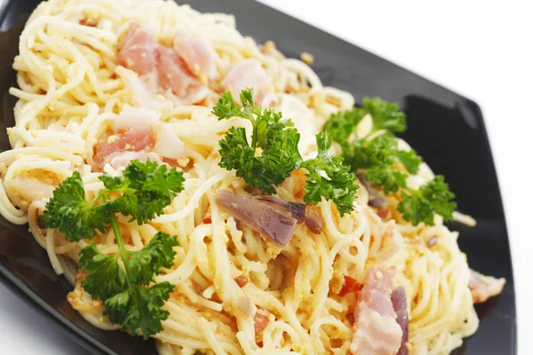 Spaghetti carbonara with fried bacon — Stock Photo, Image