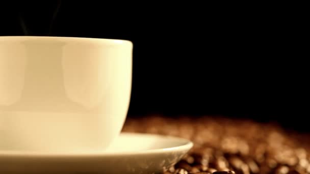 Warm cup of coffee on black background — Stock Video