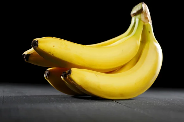 Bananas on black background — Stock Photo, Image