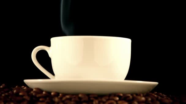 Warm cup of coffee on black background — Stock Video