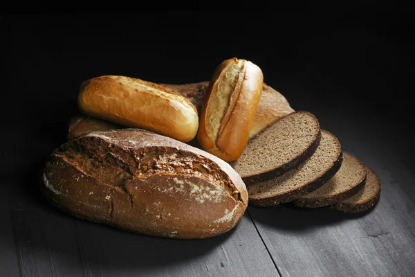 Various sliced bread on table — Stock Photo, Image