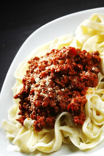 Spaghetti bolognese with parmesan cheese — Stock Photo, Image