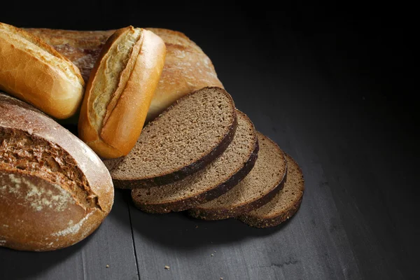 Various sliced bread on table — Stock Photo, Image