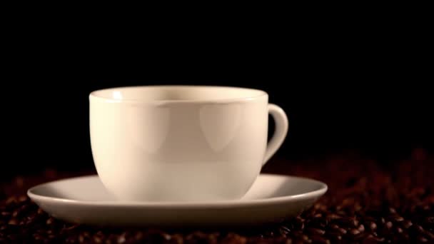 Warm cup of coffee on black background — Stock Video