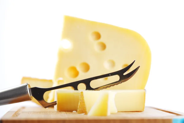 Cheese with a cheese knife — Stock Photo, Image