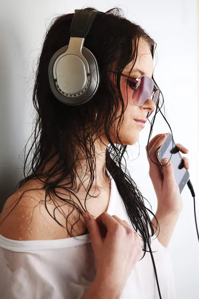 Woman in phones — Stock Photo, Image