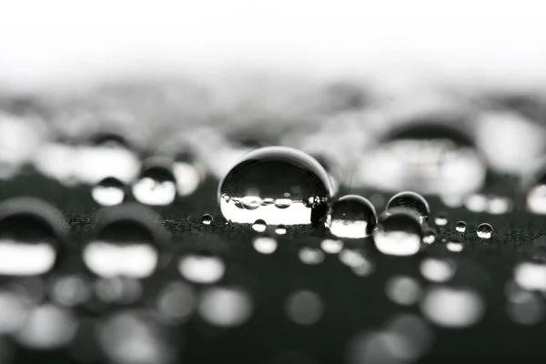 Gotas de agua en superficie gris —  Fotos de Stock