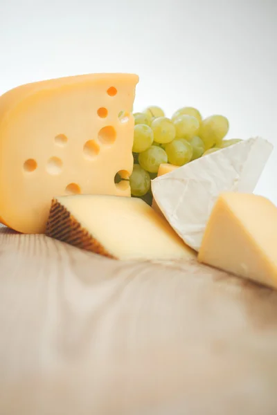 Cheese on a wooden table — Stock Photo, Image