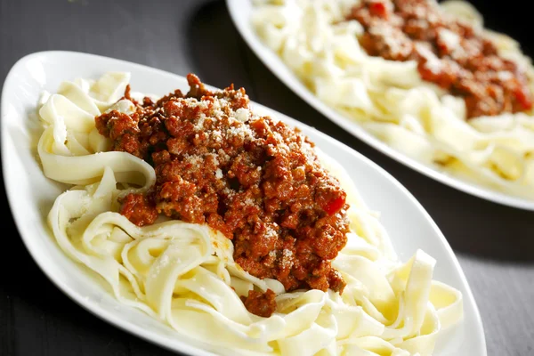 Spaghetti bolognese with parmesan cheese — Stock Photo, Image