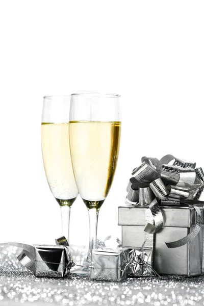 Champagne glasses and gifts — Stock Photo, Image
