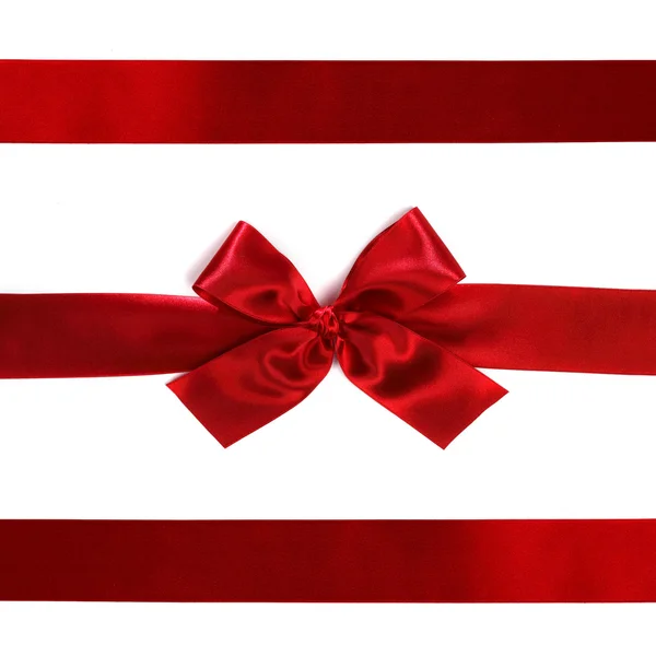 Red ribbon with bow on white — Stock Photo, Image