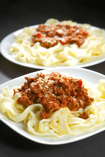 Spaghetti bolognese with parmesan cheese — Stock Photo, Image
