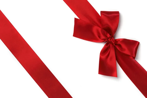 Red ribbon with bow on white — Stock Photo, Image