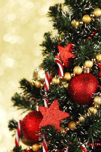 Decorated Christmas tree on glitter background Stock Picture