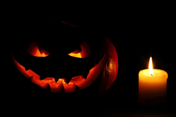 Abóbora e vela de Halloween — Fotografia de Stock