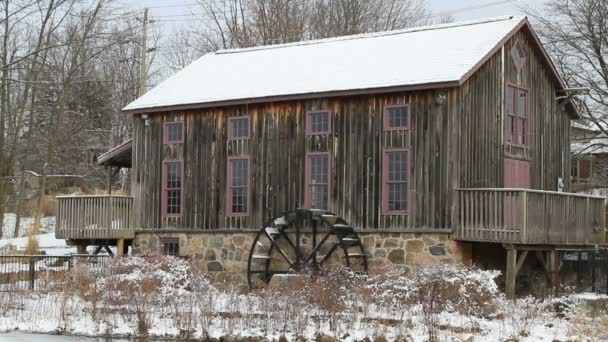 Old water mill in Waterloo, Ontario in snowy day. — Stock Video