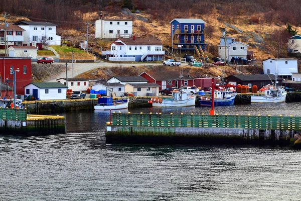 Protective wall and entrance to Petty Harbor. Moored fishing Boats. — Stock Photo, Image