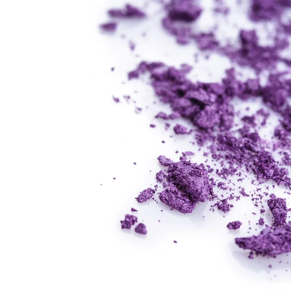 Crushed purple eye shadow on white background — Stock Photo, Image