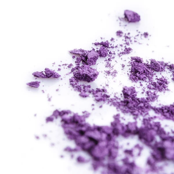 Crushed purple eye shadow on white background — Stock Photo, Image