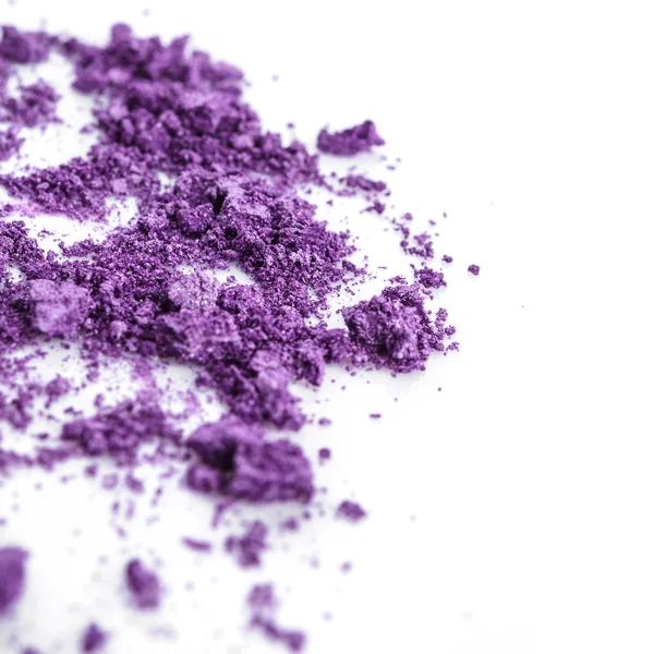 Crushed purple eye shadow on white background — Stock Photo, Image