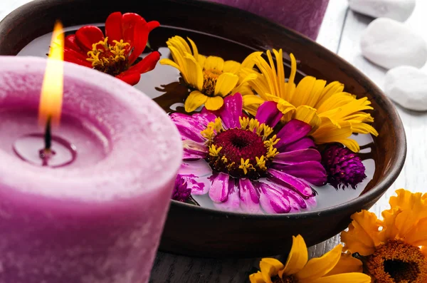 Candle with wildflowers — Stock Photo, Image