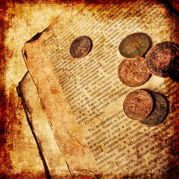 Old decrepit book with copper coins — Stock Photo, Image