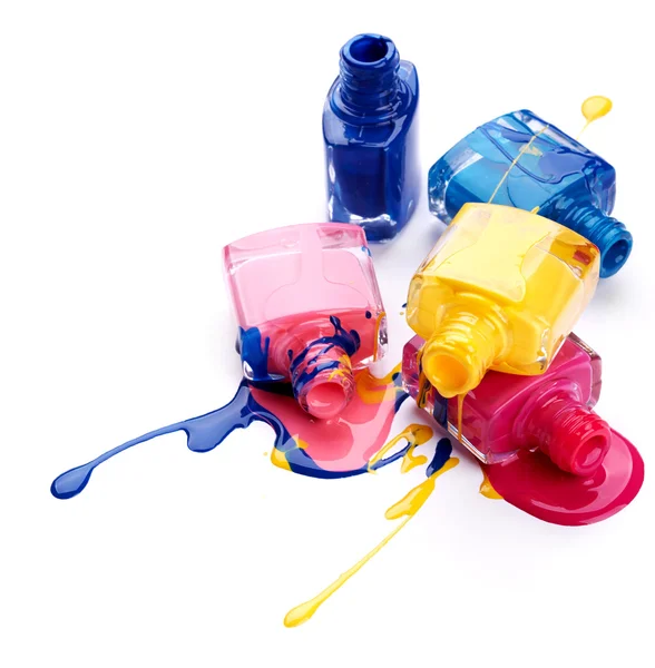 Bottles with spilled nail polish — Stock Photo, Image