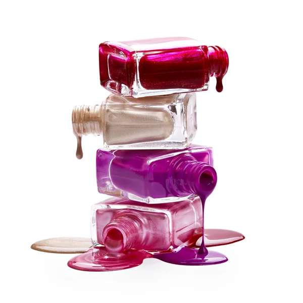 Bottles with spilled nail polish — Stock Photo, Image