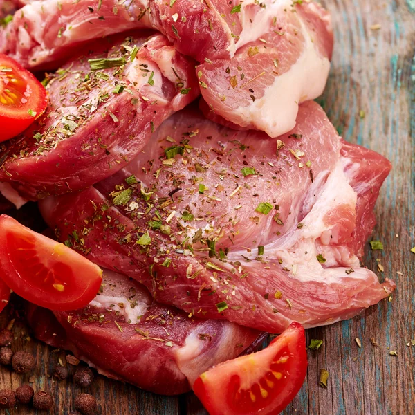 Steaks with tomatoes — Stock Photo, Image