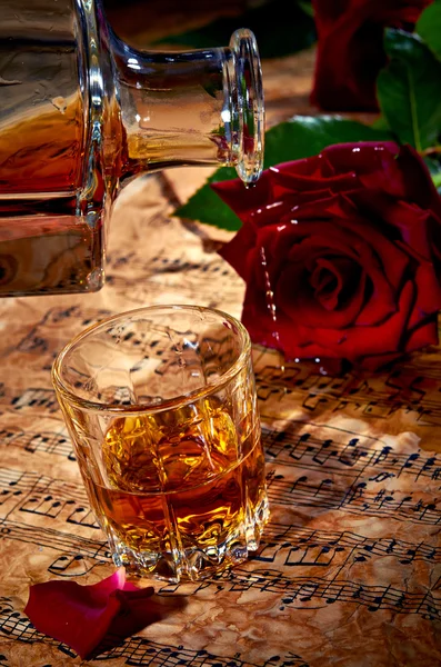 Cognac with red rose — Stock Photo, Image
