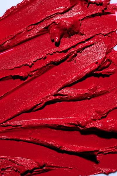 赤い口紅の質感をスマッジ 要約口紅の美しさ化粧品の背景 — ストック写真