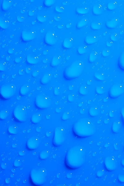 Makroaufnahme Mit Wassertropfen Auf Blauer Flacher Oberfläche Abstrakter Blauer Hintergrund — Stockfoto