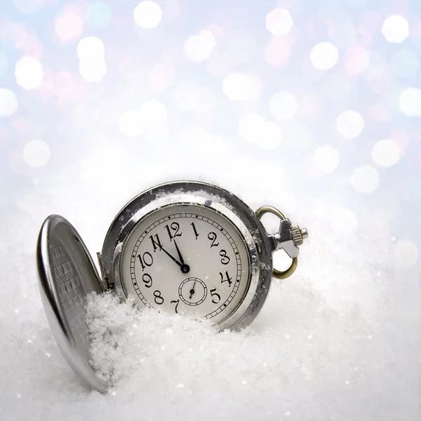 Watch lying in the snow Stock Image