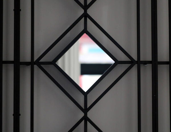 Photo background of an unusual wall with geometric ornament and mirror