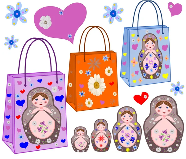 Sacos de compras com as ninho-bonecas russas, por cores e corações — Fotografia de Stock