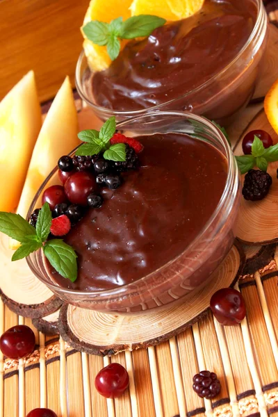 Chocolate pudding with berries and mint — Stock Photo, Image