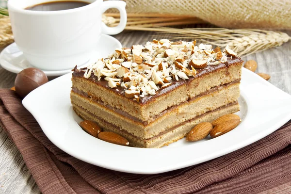 Almonds and chocolate cake — Stock Photo, Image