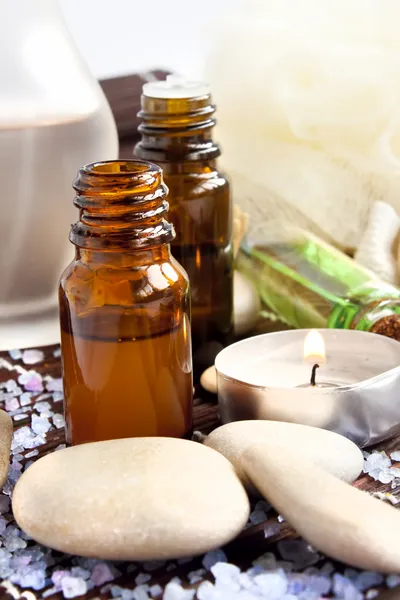 Spa essences,candle and massage stones — Stock Photo, Image