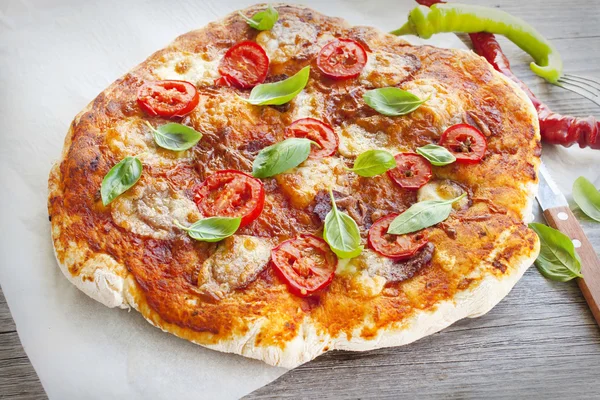 Pizza with salami and basil homemade — Stock Photo, Image