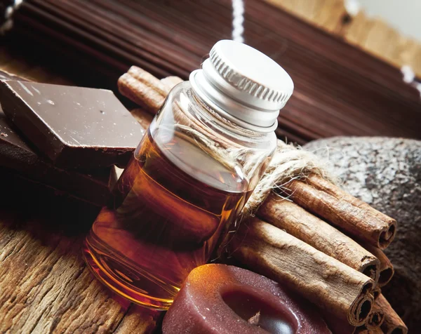 Essential Oil with Cinnamon and Chocolate — Stock Photo, Image