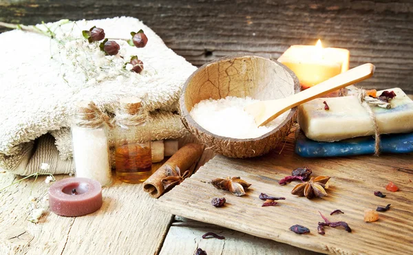 Spa Setting with Sea Salt,Essence Bottles,Natural Soap, Towel, Candle — Stock Photo, Image