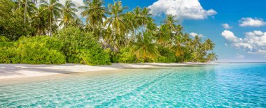 Panoramic landscape view of white beach sand sea water and blue sky clear background. 