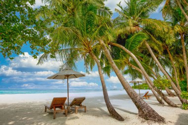 Panoramic landscape view of white beach sand sea water and blue sky clear background. 
