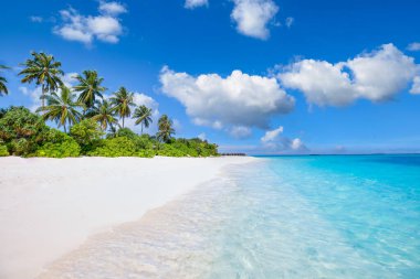 Panoramic landscape view of white beach sand sea water and blue sky clear background. 