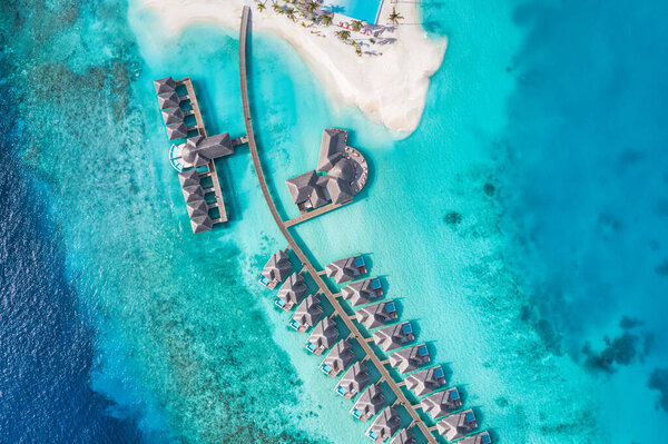 Aerial view of resort bungalows on sea shore