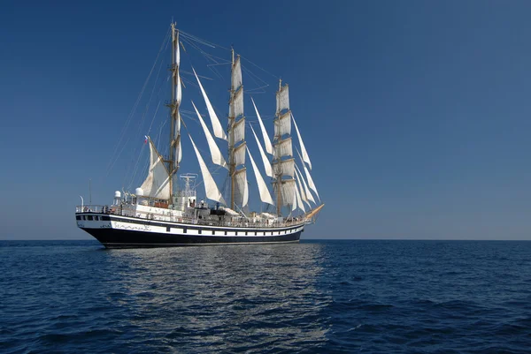 Sailing frigate under full sail in the ocean Stock Picture