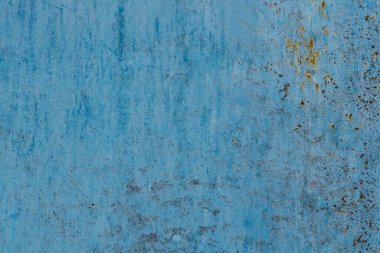 Aşınma bölgeleriyle metal doku. Metalin eski ve paslı yüzey yapısı mavi boyayla boyanmış, yüksek çözünürlüklü..